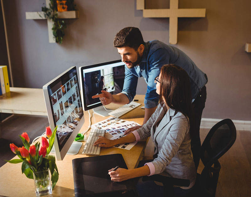 Web design team refining a business website